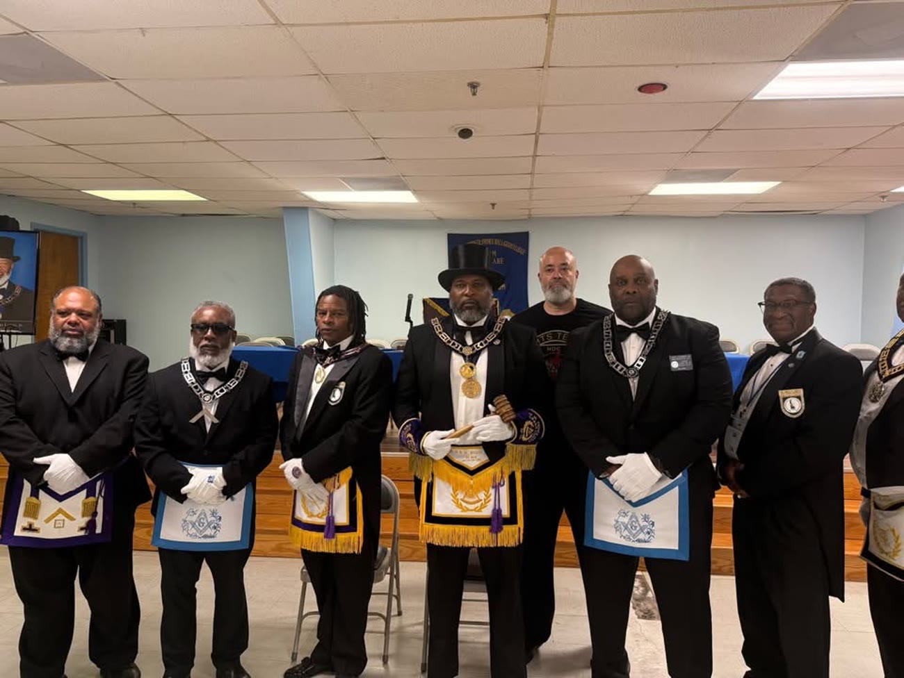 The officers stand for the Installation